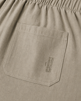 Close-up of back patch pocket with tonal Nostalgic Since Forever embroidery