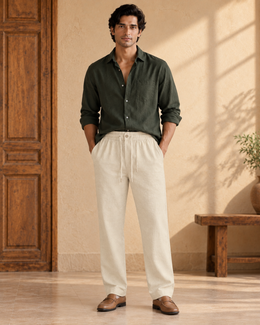 Man wearing Solah Anna beige linen cotton pajama pants in a full front view