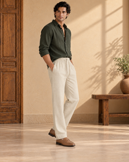 Three-quarter view of men’s beige linen cotton pajama pants with a straight fit