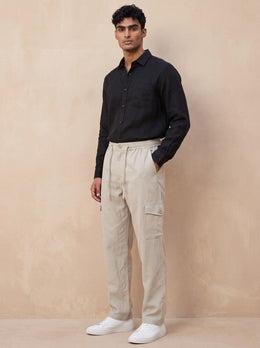 Three-quarter front view of men’s cream cotton straight-leg cargo pants