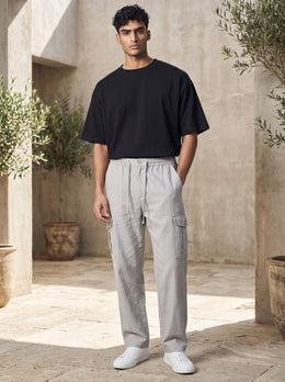 Alternate full front view of men’s grey cotton linen cargo pants with elastic drawcord waist