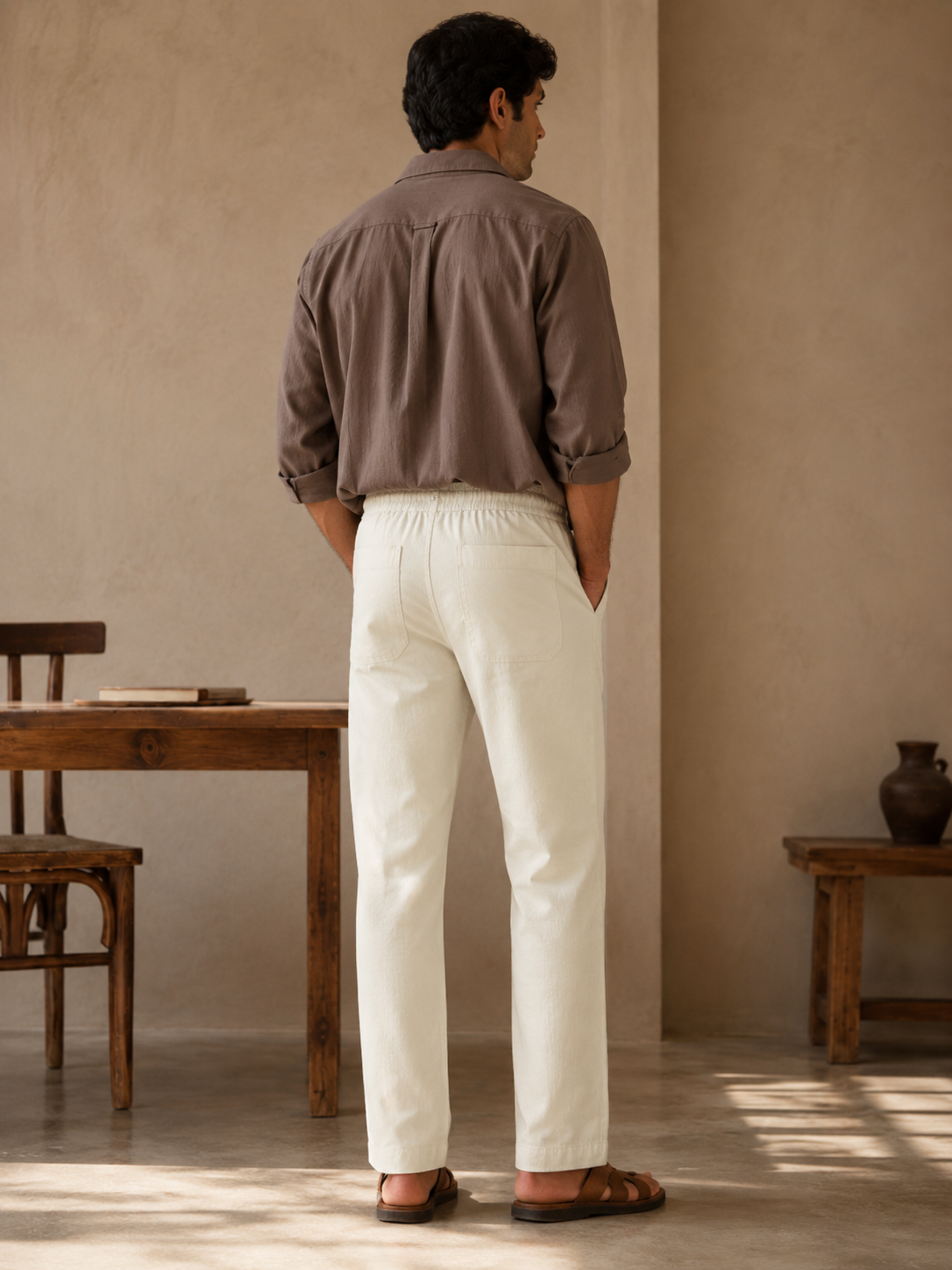 Side view of white cotton linen pajama pants with slant pocket