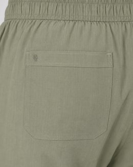 Close-up of Pista pants back patch pocket with tonal SA 16 embroidery